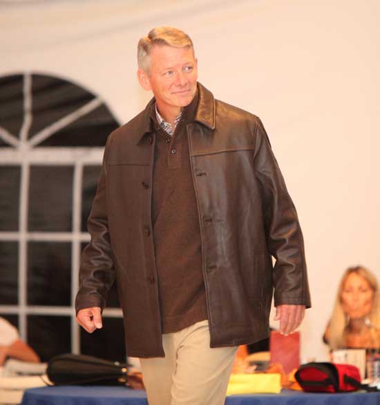 Board of Selectmen candidate Bill Johnson models a car-coat length leather jacket by Missani over a polo sweater and silk dress pants from Tommy Bahama.