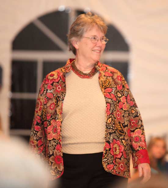 Audrey Ball of the League of Women Voters models a batik printed jacket in warm fall colors from the world market collection by Alfred Dunner.