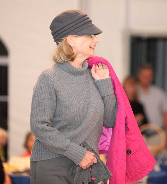 Debbie Ricci, a former Finance Committee chairman, sports a turtleneck sweater by Ghant and a newsboy cap by Parkhurst offset by a bright fuchsia quilted jacket.