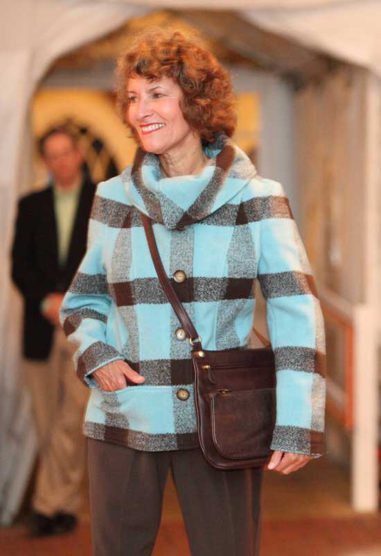 Di Newton, representing the Harvard Historical Society, models a bold aqua and chocolate checked jacket and trousers by Composed.
