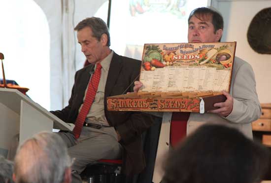 Willis Henry and David Glynn dispaly a Shaker seed box which sold for $2,500. 