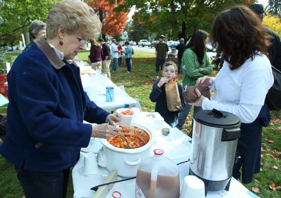 Gretchen Henry serves up a hearty vegetarian harvest stew at the Apple Festival. 