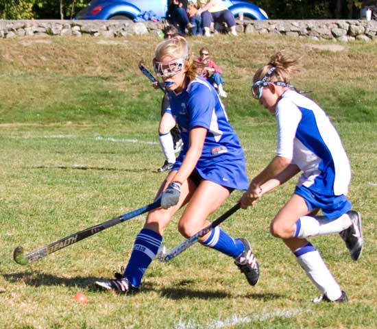 Elizabeth Smetana races past an opponent in a recent field hockeygame against Murdock High School.  