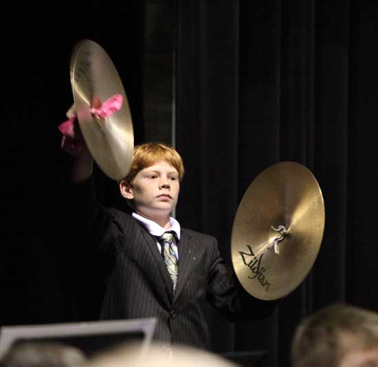 Tyler Brandom plays cymbals in the middle school's symphonic band concert on Oct. 15.