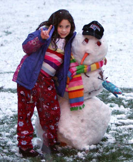 Nine-year-old Abby Zajac takes advantage of the early snowfall to make the season’s first snowman. (Courtesy photo)