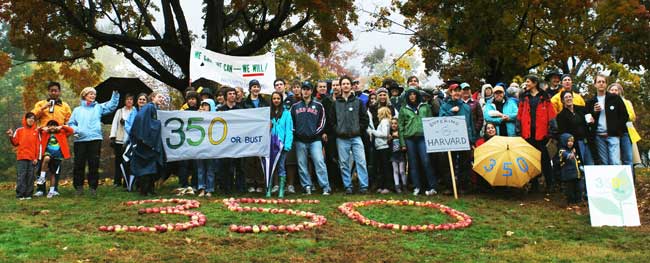 More than 80 people gathered in the rain on Oct. 24 on the town Common as part of more than 5,000 events worldwide coordinated by 350.org to urge leaders to take quick and decisive action on global warming. (Photo by Sue Fitterman)