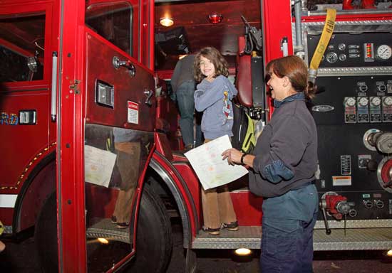 Maddie Hill climbs aboard Engine 2.