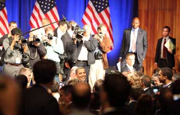 Photographers storm the stage as the president meets and greets. (Photo by Lisa Aciukewicz) Photographers storm the stage as the president meets and greets. (Photo by Lisa Aciukewicz)