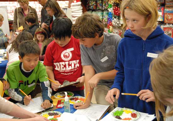 Harvard Elementary School fifth graders take part in Market Math at Roche Brothers in Acton. (Photo by Stephen Into)