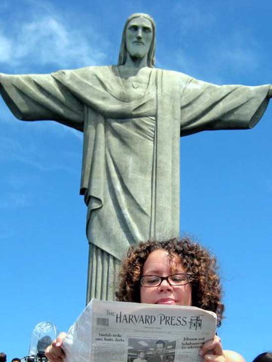 Still River Road resident Angela Gaffney reads the Press in Brazil under the watchful eye of Rio de Janeiro's most famous resident