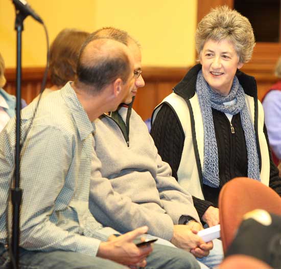 Lucy Wallace (right) chats with Mark Sevigny (left) and Marc Mikitarian before the start of the selectman candidates debate on Nov. 12.