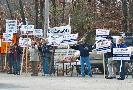 Supporters of Board of Selectmen candidates Marie Sobalvarro and Bill Johnson campaign at the transfer station on Nov. 21. (Photo by Tyler Papazian)
