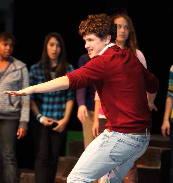 Ninth grader Owen Alderson rehearses with the cast of Zombie Prom at the Cronin Auditorium.