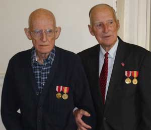 Twin brothers PJ (left) and Peter Johnston at this year's Veterans Day ceremony where they received Army Good Conduct medals and National Defense Service medals. (Courtesy photo by Kelly S. Lyddy)