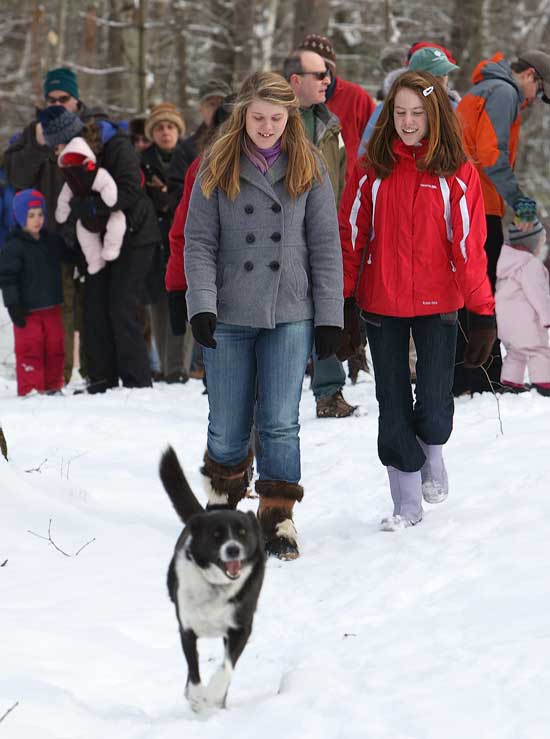 Bromfield freshmen Rhett Nuenighoff and Haley Newsham lead a group on a New Year's Day walk sponsored by the Harvard Conservation Trust at the Harris Land and Vaughn Hill conservation areas.