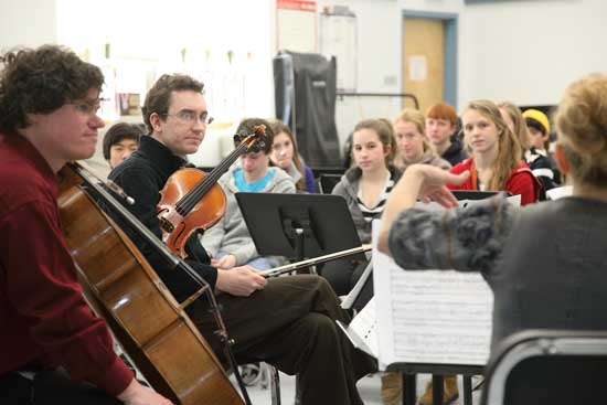 Members of the Worcester Chamber Music Society perform a newly composed piece by Mark Berger (second from left) for Bromfield students on Jan. 11.
