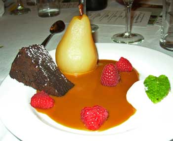 Saving the best for last. Dessert consists of flourless chocolate cake and cider-poached pear in a pool of caramel cream. (Photo by Barbara Kemp) Saving the best for last. Dessert consists of flourless chocolate cake and cider-poached pear in a pool of caramel cream. (Photo by Barbara Kemp)