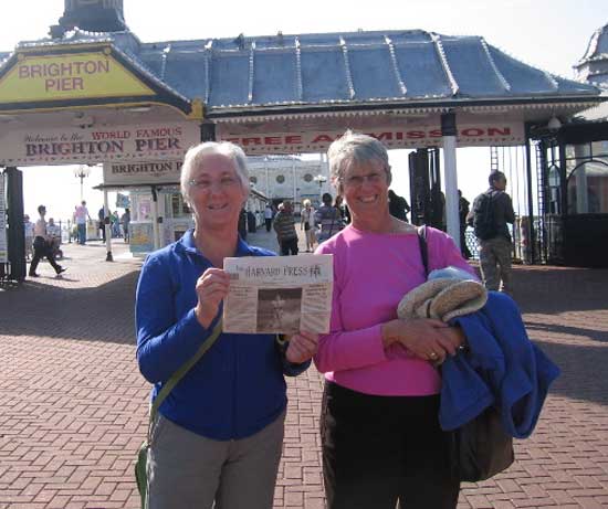 Faith Cross (left) of Shaker Road and Judy Warner of South Shaker Road visit Brighton, England, with their favorite newspaper in hand.