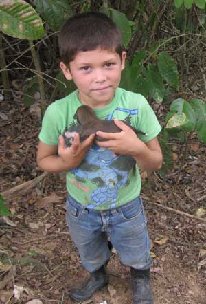 A little boy holds a puppy born on the farm where the mission team stayed in 2009. (Courtesy photo) A little boy holds a puppy born on the farm where the mission team stayed in 2009. (Courtesy photo)