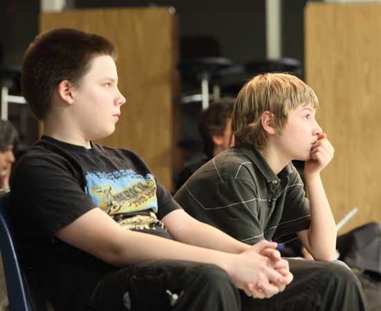Sixth-graders Jonathan Schmidt (left) and Brian Johnson, the "roadies" for the show, enjoy the performances.