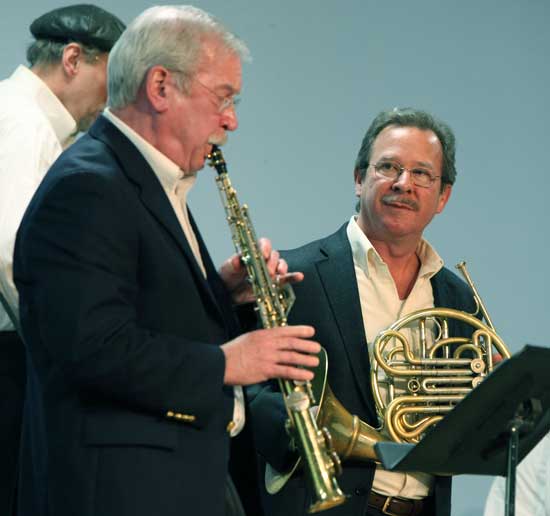 Glenn Williams plays a solo as Jim Phelan waits his turn at Fanfare's first annual benefit talent show Feb. 11.