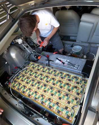Hunter Strong checks out the battery pack in his family’s Prius.(Courtesy photo)