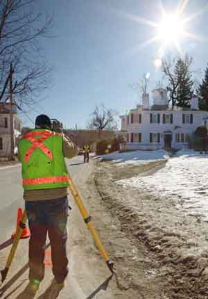Peter Giakoumis (left) and Peter Jandrisevits of Weston & Sampson Engineering, Inc. take measurements on Feb. 7 while surveying for the town center sewer project. (Photo by Lisa Aciukewicz) Peter Giakoumis (left) and Peter Jandrisevits of Weston & Sampson Engineering, Inc. take measurements on Feb. 7 while surveying for the town center sewer project. (Photo by Lisa Aciukewicz)