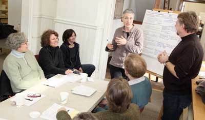 From left: Sharon Briggs, Di Newton, Jackie Normand, Helen Hill, and Tim Firment sum up ideas about a community center at a second charrette held Feb. 27 to discuss municipal building use in the center of town. (Photo by Lisa Aciukewicz)
