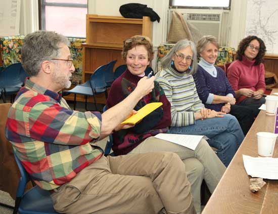 From left: Jim Saalfield, Sharon McCarthy, Cary Browse, Kathy Jackson, and Angela Gaffney discuss one of the options for town center buildings at a second charrette held Feb. 27 at the old library.