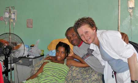 Patricia Ruze (right) poses with a girl with a spinal column injury and her father. (Courtesy photo) Patricia Ruze (right) poses with a girl with a spinal column injury and her father. (Courtesy photo)