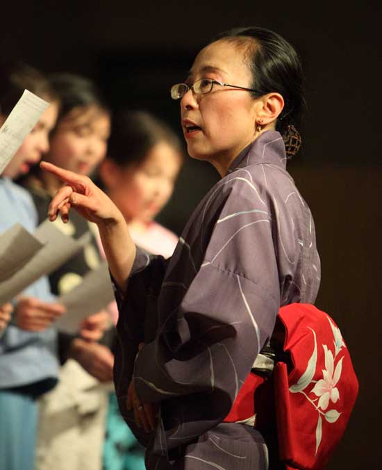 Naomi Yano leads third-grade singers in a traditional Japanese song to welcome spring.