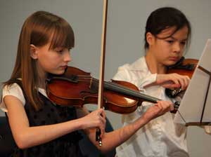 Rebekah Lindsey and Natalie O’Leary play Corelli’s “Prelude and Dance” as part of a string quintet. Rebekah Lindsey and Natalie O’Leary play Corelli’s “Prelude and Dance” as part of a string quintet.