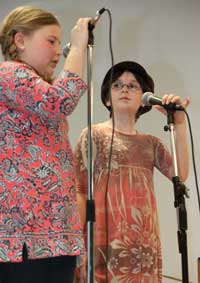 Maggie Gill (left) and Caroline Hentz sing a duet of Taylor Swift’s “You Belong with Me.” Maggie Gill (left) and Caroline Hentz sing a duet of Taylor Swift’s “You Belong with Me.”