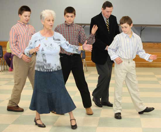 From left, Jonathan Schmidt, Phyllis Norton, Ben Neville, Richard Norton, and Nick Evans learn to promenade.