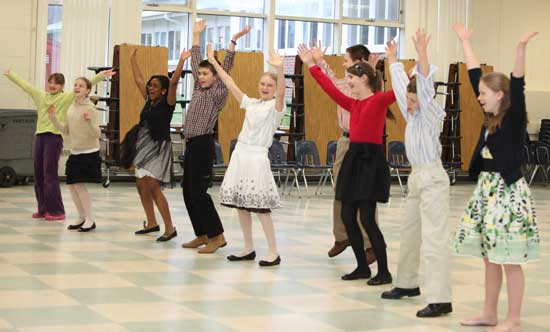 The class takes a break from more formal dance steps to try  their skill at the Village People’s “YMCA."
