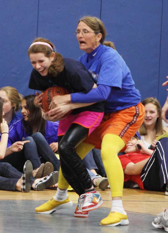 Senior Moriah Katz (left) gets a big hug—or a big foul—from teacher Sue Silver; you decide!