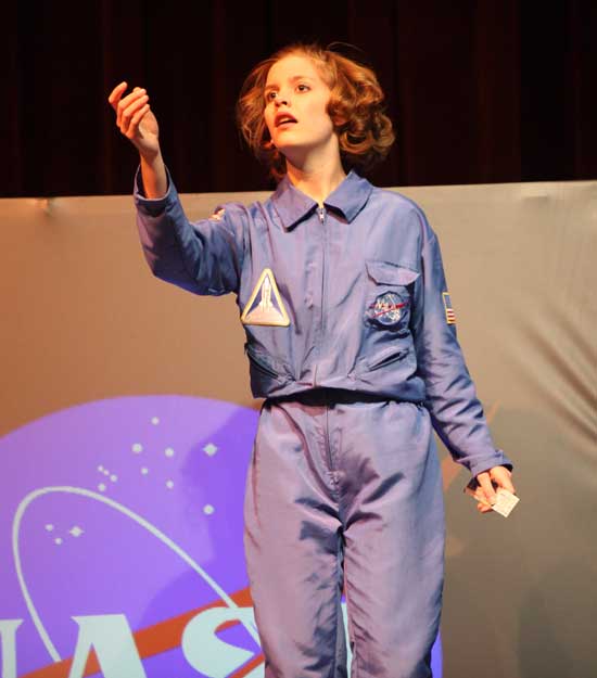 Senior Becca Turner portrays teacher-astronaut Christa McCauliffe in Defying Gravity.