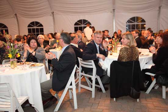 The crowd of nearly 200 fills the tent at Fruitlands