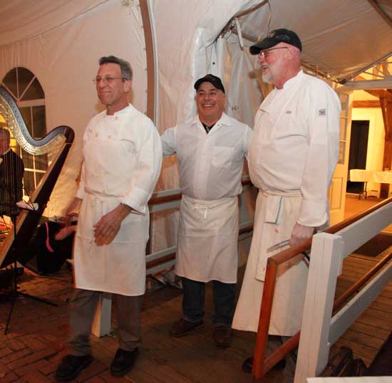 The "Food Dudes," from left, Chefs Paul Correnty, Chris Basile, and Jeff Shaw, take a bow after dinner.