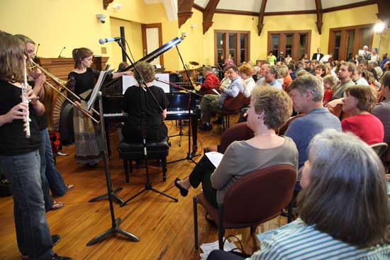 The crowd listens to the Martinko family—Victoria Martinko, Chrissanna Grove, and Amber Martinko—perform Pat Benatar’s  “We Belong.”