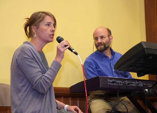 Helen Batchelder, singing Joni Mitchell's "River," is accompanied by Jeff Ewald.