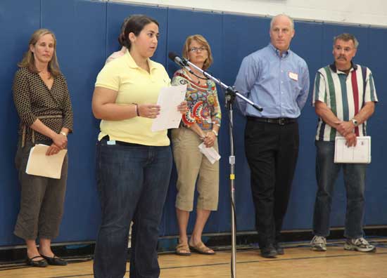 Bromfield senior Andrea D’Eramo (second from left) speaks about the impact of student user fees for athletics at her first town meeting as School Committee member Virginia Justicz, Anne Marie Rowse, Bromfield Principal Jim O’Shea, and Coach Tom Hill look on.