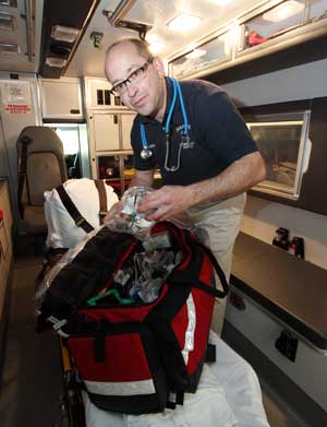 Steve Beckman replaces supplies in a jump kit after an ambulance run. (Photo by Lisa Aciukewicz) Steve Beckman replaces supplies in a jump kit after an ambulance run. (Photo by Lisa Aciukewicz)
