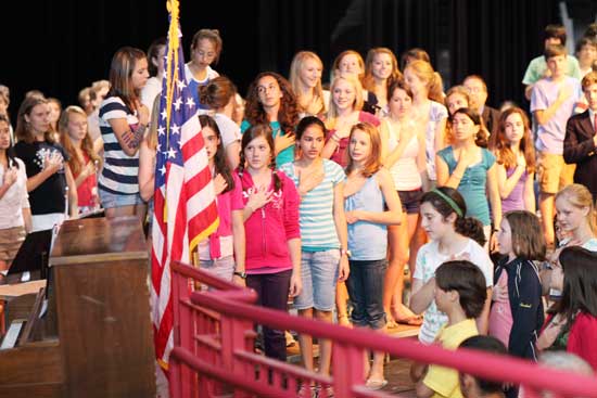 Students say the Pledge of Allegiance at a Memorial Day ceremony at Bromfield on Friday, May 28.