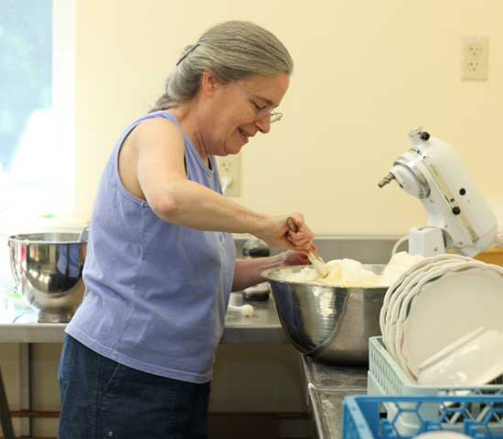 Dorothy Solbrig mixes pancake batter for the annual Memorial Day pancake breakfast at the Unitarian Universalist Fellowship Building. The breakfast raises money for Loaves & Fishes food pantry in Devens