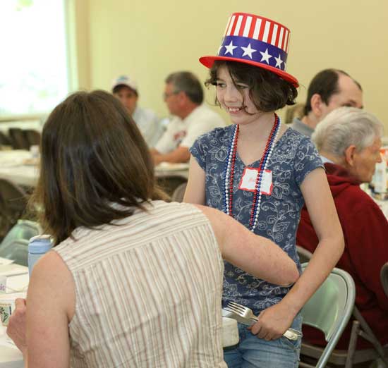 Waitress Maddy Hill takes orders at the pancake breakfast