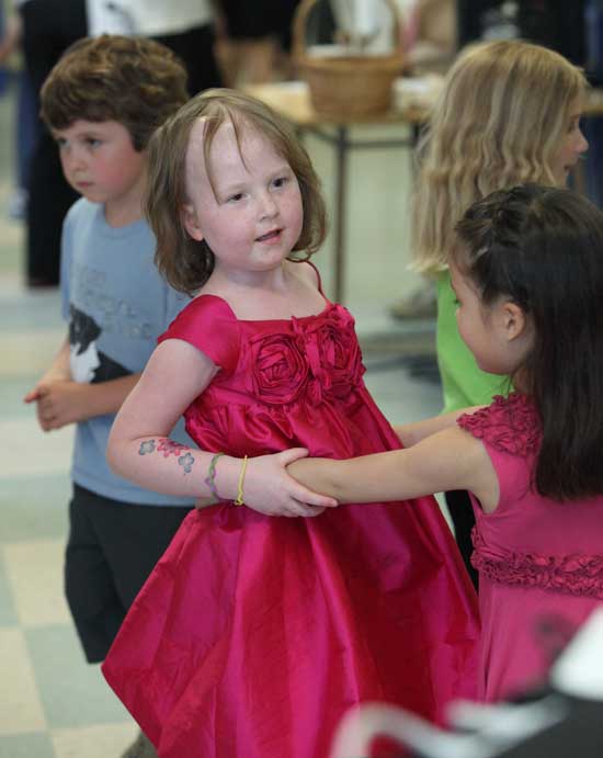 Charlotte O’Shea dances with her friend Jocelyn Cote.