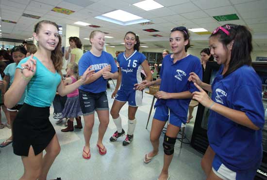 Alicia Vellante, Lena Karotkin, Nicole West, Heather Grant, and Jillian Nelson sing and dance to the music.