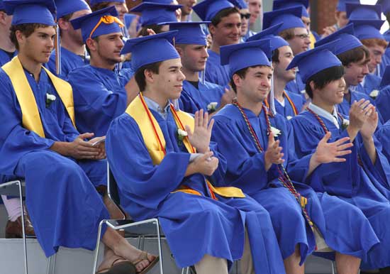 Seniors applaud after Dominique Ledoux’s speech. Front row, from left: Danny Eisenberg, Dan Cooke, and Peter Young. Back row: Scott Myslinski, Mike Cilluffo, and Brandon Tomm.