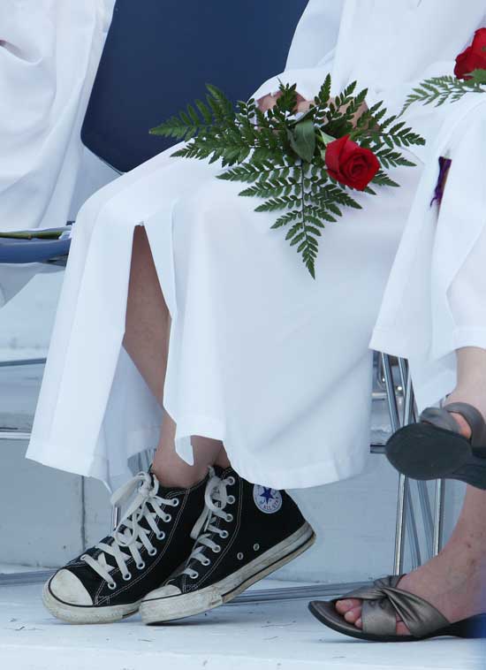 Footwear choices for graduation vary from  bare feet to sandals to Clara Verheyen’s Converse All Star hi-top sneakers.